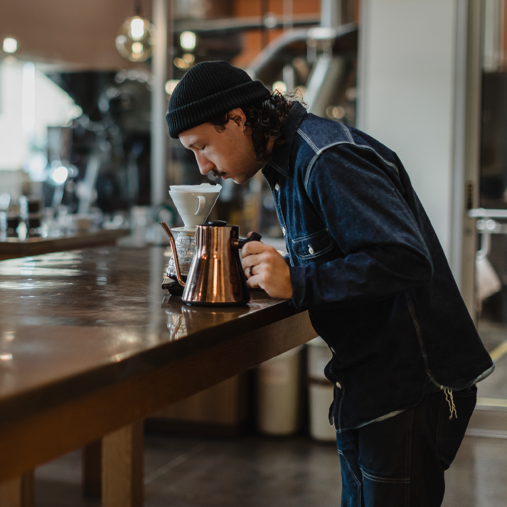 Nick Breheny brews coffee in the lab