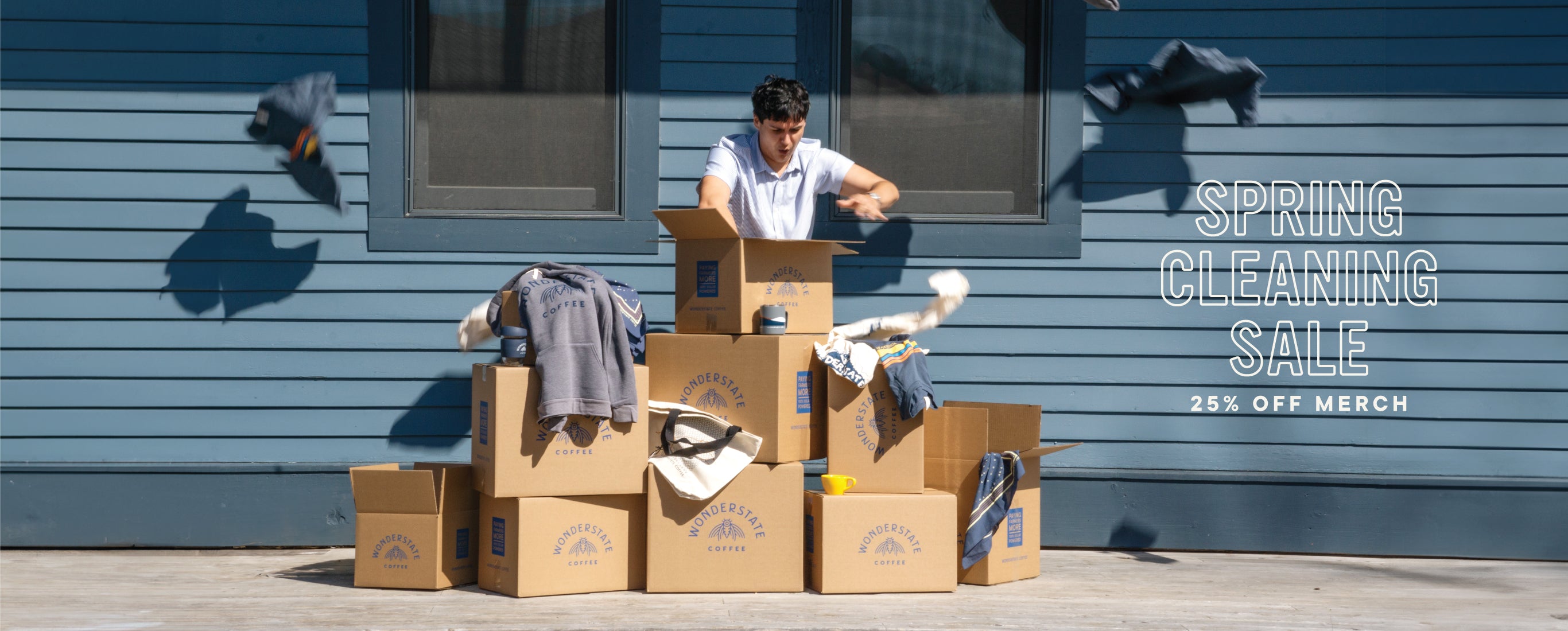 person sorting through boxes of clothing