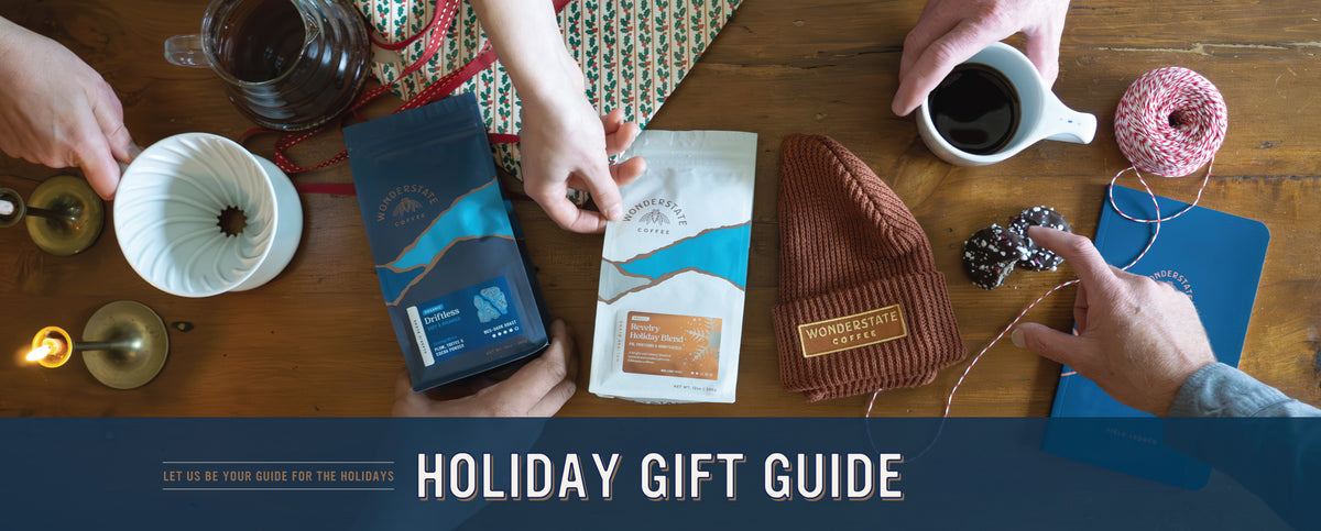 Table top with gifts including coffee, beanie, and notebook.

Holiday Gift Guide: Let us be your guide for the holidays